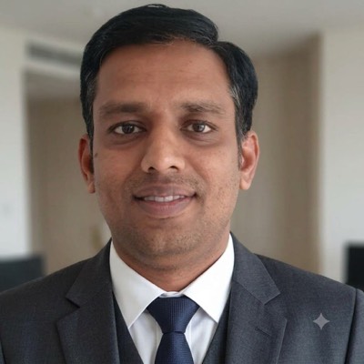 Portrait of Dr. Raghavendra Ramesh, founder of PrimusCredence